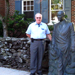 Fred Hawthorne with the statue of President Dwight D. Eisenhower