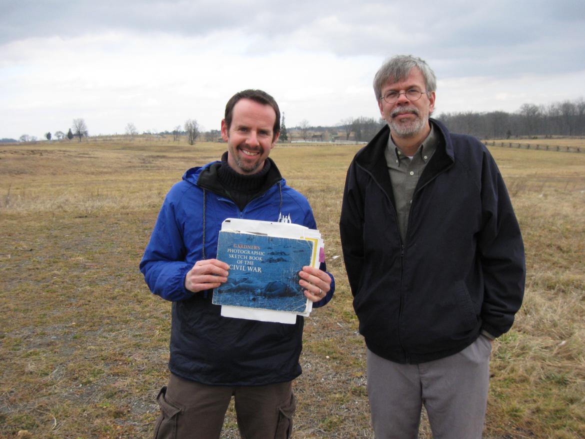 Gary holding Alexander Gardner’s Photographic Sketch Book of the Civil War