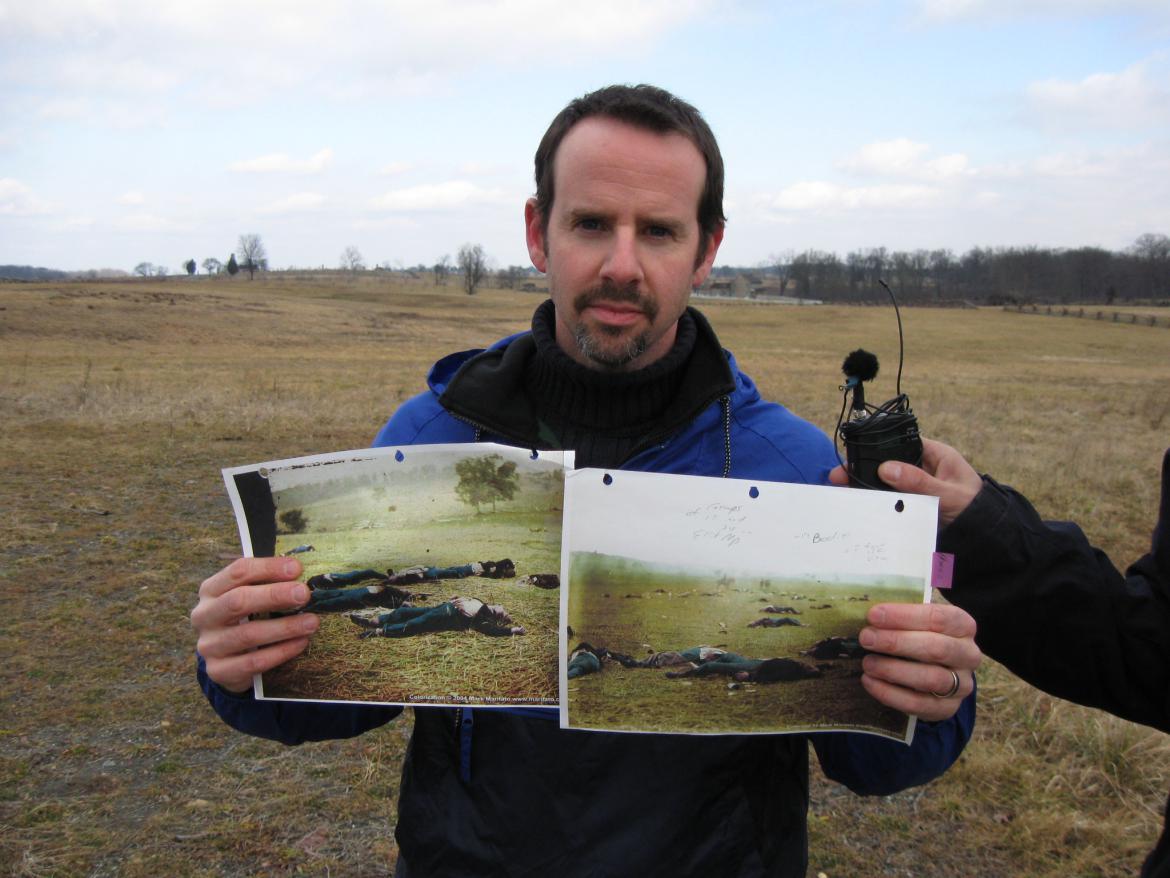 Garry Adelman holding colorized versions of the Harvest of Death plates